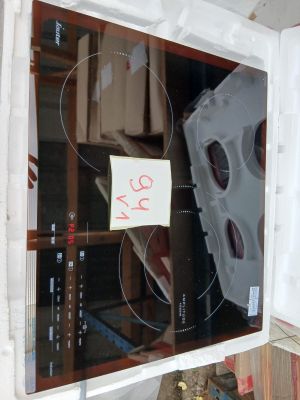 a refrigerator with a glass door and a sign on it