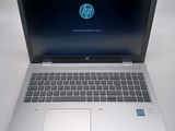 an open laptop computer sitting on top of a white table
