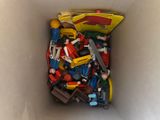 a box full of toy cars and other toys in it