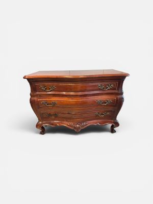 a wooden chest of drawers with a drawer on top of it