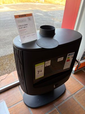 a coffee cup sitting on top of a black stove