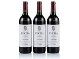 three bottles of wine sitting next to each other on a white surface
