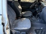 a van that has been vandalized and is parked in the street