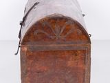 an old wooden trunk with a metal handle and a metal latch