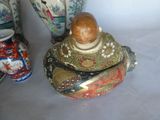 many vases that are sitting next to each other on a table