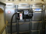 une image représentant un réservoir sur lequel est fixé un compteur d'eau