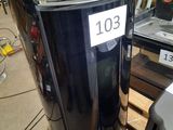 an image of a black trash can on a pallet in a warehouse