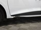 a close up of a white car on a checkered floor