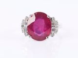 an oval ruby and diamond ring