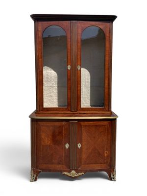 an image of a wooden cabinet with glass doors and a marble top