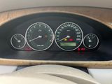 a close up of a car dashboard with various gauges