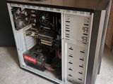 a computer case with a fan and a hard drive in it