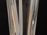a glass with a toothbrush in it on a table