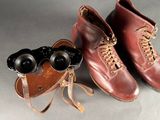 two pairs of shoes and a pair of binoculars
