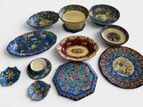 a lot of different plates and bowls on the table