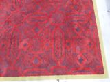 a red and blue rug with a pattern on it