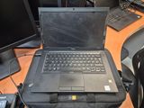 a laptop computer sitting on top of a black case