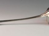 a spoon with a spoon rest on it on a table