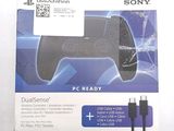 packaging of a sony playstation game controller with a charger attached