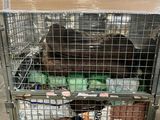 a metal cage with a bunch of items inside of it