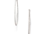 a pair of diamond hoop earrings on a white background