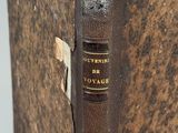 an old book with a bookmark on the front and a bookmark on the back
