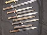 a lot of knives that are on a table