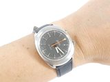 wrist shot of a person with a watch on their wrist