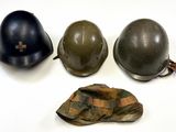 three helmets and a hat are sitting on a white surface