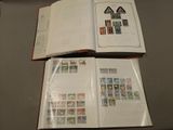 a book with stamps on it sitting on a table