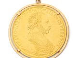 l'image d'une pièce d'or sur laquelle figure le visage d'une femme