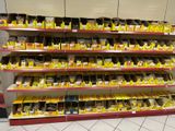 many shelves with different types of chocolates on them