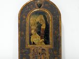 tableau représentant la Vierge à l'Enfant, dans un cadre en bois sur un fond blanc
