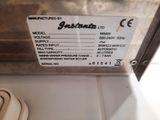 a picture of a sign on the side of a refrigerator