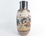 a vase with a painting on it on a white background