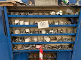 a blue workbench with lots of tools on top of it