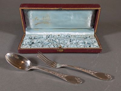 two spoons and a fork in a box