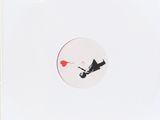 an image of a white record with a red balloon in the middle of it