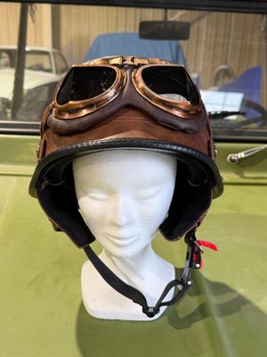 a mannequin head wearing a helmet with goggles on it