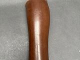 a person holding a large leather object in their hand