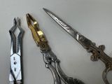 three pairs of scissors sitting next to each other on a table