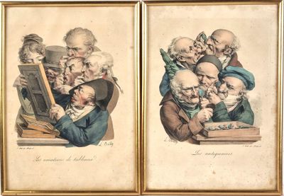 two framed pictures of old men sitting at a desk with a book