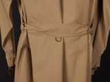 a close up of a trench coat on a mannequin mannequin mannequin mannequin mannequin mannequin mannequin manne