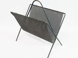 an image of a metal magazine rack on a white background
