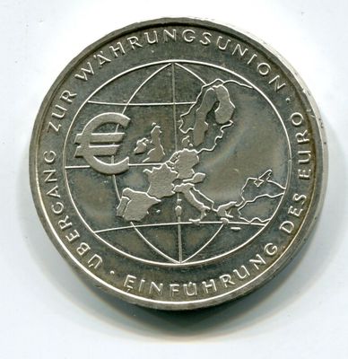 une pièce d'argent sur laquelle est représentée une carte