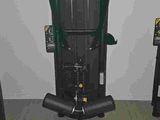 a black and green machine sitting on a black chair