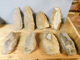 a wooden table with a bunch of rocks on it