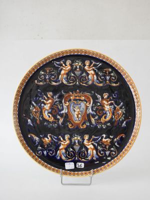 a blue and gold plate with a design on it