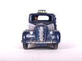 a toy car with a taxi sign on the front of it