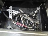 a metal box with a bunch of tools inside of it
